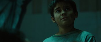 Movie still from “Battle Los Angeles” (2011), directed by Jonathan Liebesman – A young boy is looking up at the ceiling; Close Up shot, Low angle
