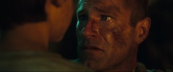 Movie still from “Battle Los Angeles” (2011), directed by Jonathan Liebesman – A man's face with blood all over his face; Close Up shot, Over the shoulder angle