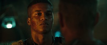 Movie still from “Battle Los Angeles” (2011), directed by Jonathan Liebesman – A person looking at another person; Close Up shot, Over the shoulder angle