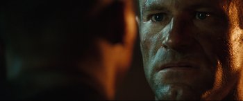 Movie still from “Battle Los Angeles” (2011), directed by Jonathan Liebesman – A man's face in front of a mirror; Close Up shot, Over the shoulder angle