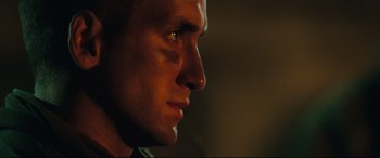 Movie still from “Battle Los Angeles” (2011), directed by Jonathan Liebesman – A man's face in the dark; Close Up shot, Low angle