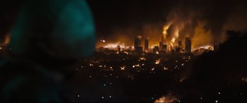 Movie still from “Battle Los Angeles” (2011), directed by Jonathan Liebesman – A large fire burning in a city at night; Extreme Wide shot, High angle