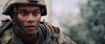 Movie still from “Battle Los Angeles” (2011), directed by Jonathan Liebesman – A person wearing a military uniform; Close Up shot, Low angle
