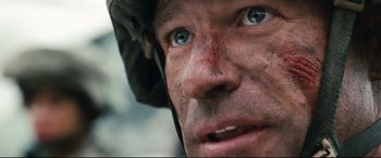 Movie still from “Battle Los Angeles” (2011), directed by Jonathan Liebesman – A person wearing a helmet; Close Up shot, Low angle