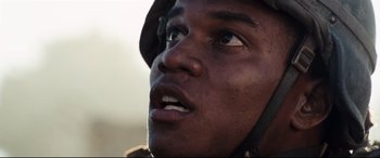 Movie still from “Battle Los Angeles” (2011), directed by Jonathan Liebesman – A person wearing a hat; Close Up shot, Low angle