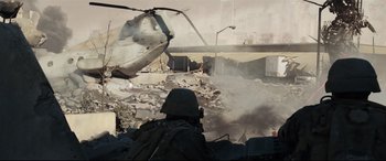 Movie still from “Battle Los Angeles” (2011), directed by Jonathan Liebesman – A helicopter is flying through the air near a building; Extreme Wide shot, High angle