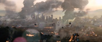 Movie still from “Battle Los Angeles” (2011), directed by Jonathan Liebesman – A group of helicopters flying over a large city; Extreme Wide shot, Overhead angle