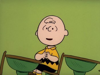 Movie still from “Be My Valentine, Charlie Brown” (1975), directed by Phil Roman – A charlie brown character sitting on a bench; Medium shot, High angle