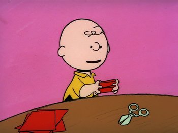 Movie still from “Be My Valentine, Charlie Brown” (1975), directed by Phil Roman – A drawing of a bald man holding a pair of scissors; Medium shot, High angle