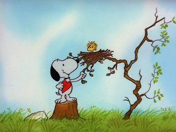 Movie still from “Be My Valentine, Charlie Brown” (1975), directed by Phil Roman – A painting of a dog sitting on a tree stump and looking at a bird in a nest on top of a tree stump; Extreme Wide shot, Low angle