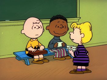 Movie still from “Be My Valentine, Charlie Brown” (1975), directed by Phil Roman – A group of people standing next to each other in front of a chalkboard; Wide shot, High angle