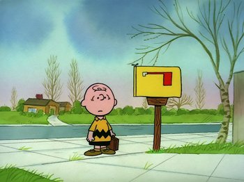 Movie still from “Be My Valentine, Charlie Brown” (1975), directed by Phil Roman – A charlie brown character standing in front of a mailbox; Wide shot, High angle