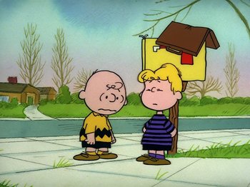 Movie still from “Be My Valentine, Charlie Brown” (1975), directed by Phil Roman – A couple of people standing next to each other on a sidewalk; Wide shot, High angle