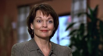 Movie still from “Bean” (1997), directed by Mel Smith – A person wearing a jacket; Close Up shot, Low angle