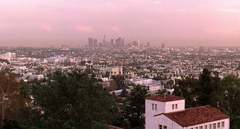 Movie still from “Bean” (1997), directed by Mel Smith – A view of a city from a hill; Extreme Wide shot, High angle