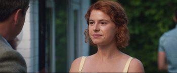 Movie still from “Beast” (2017), directed by Michael Pearce – A person with curly red hair; Close Up shot, Over the shoulder angle