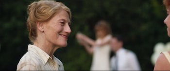 Movie still from “Beast” (2017), directed by Michael Pearce – An older woman smiles while a younger woman watches; Close Up shot, Over the shoulder angle