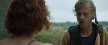 Movie still from “Beast” (2017), directed by Michael Pearce – A man and a woman looking at each other in a field; Close Up shot, Over the shoulder angle