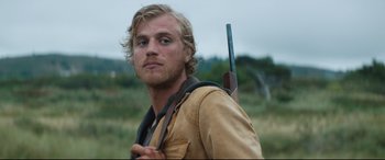 Movie still from “Beast” (2017), directed by Michael Pearce – A person holding a gun; Close Up shot, Low angle