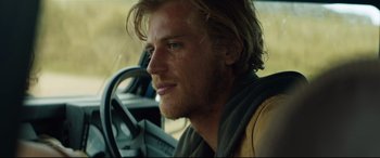Movie still from “Beast” (2017), directed by Michael Pearce – A person sitting in a car; Close Up shot, Low angle