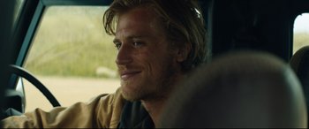 Movie still from “Beast” (2017), directed by Michael Pearce – A person sitting in a car; Close Up shot, Over the shoulder angle