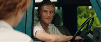 Movie still from “Beast” (2017), directed by Michael Pearce – A man sitting in the driver's seat of a car; Close Up shot, Over the shoulder angle