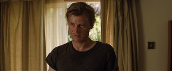 Movie still from “Beast” (2017), directed by Michael Pearce – A person wearing a brown t - shirt; Close Up shot, Over the shoulder angle