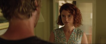 Movie still from “Beast” (2017), directed by Michael Pearce – A woman standing in front of a mirror looking at a man; Close Up shot, Over the shoulder angle