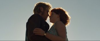 Movie still from “Beast” (2017), directed by Michael Pearce – A man and a woman are kissing in the sunlight; Close Up shot, Low angle