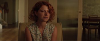 Movie still from “Beast” (2017), directed by Michael Pearce – A woman with red curly hair sitting in a chair; Close Up shot, Over the shoulder angle