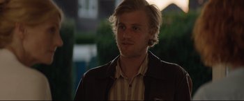 Movie still from “Beast” (2017), directed by Michael Pearce – A man with blonde hair wearing a brown jacket; Close Up shot, Over the shoulder angle