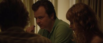 Movie still from “Beast” (2017), directed by Michael Pearce – A person sitting at a table; Close Up shot, Over the shoulder angle