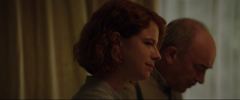 Movie still from “Beast” (2017), directed by Michael Pearce – A person wearing a white shirt; Close Up shot, Over the shoulder angle