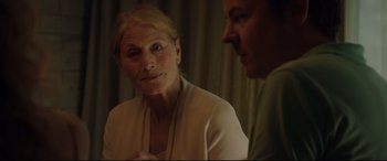 Movie still from “Beast” (2017), directed by Michael Pearce – An older woman sitting next to a younger man in a room; Close Up shot, Over the shoulder angle