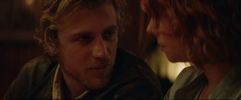 Movie still from “Beast” (2017), directed by Michael Pearce – A man and a woman sitting next to each other in a room; Close Up shot, Over the shoulder angle