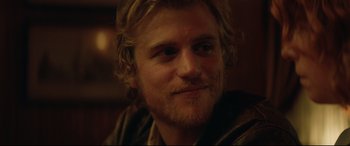 Movie still from “Beast” (2017), directed by Michael Pearce – A person with long hair and a beard; Close Up shot, Over the shoulder angle