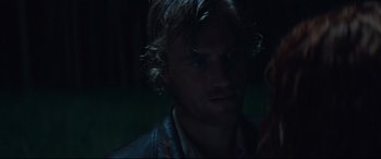 Movie still from “Beast” (2017), directed by Michael Pearce – A person wearing a leather jacket; Close Up shot, Over the shoulder angle
