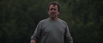 Movie still from “Beast” (2017), directed by Michael Pearce – A person wearing a gray t - shirt; Close Up shot, Low angle