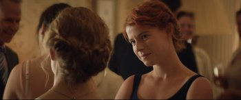 Movie still from “Beast” (2017), directed by Michael Pearce – A woman with red hair looking into a mirror; Close Up shot, Over the shoulder angle