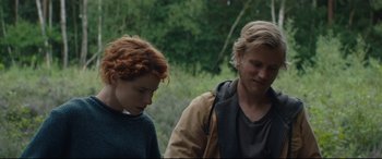 Movie still from “Beast” (2017), directed by Michael Pearce – A man and a woman standing next to each other in a field; Medium shot, Over the shoulder angle