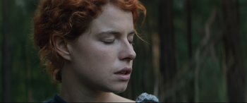 Movie still from “Beast” (2017), directed by Michael Pearce – A person with curly red hair; Close Up shot, Low angle