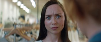 Movie still from “Beast” (2017), directed by Michael Pearce – A woman's face in a room; Close Up shot, Over the shoulder angle