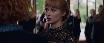 Movie still from “Beast” (2017), directed by Michael Pearce – A person wearing a black dress; Close Up shot, Over the shoulder angle