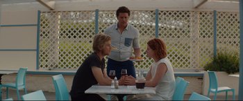 Movie still from “Beast” (2017), directed by Michael Pearce – A man and two women sitting at a table; Medium shot, Over the shoulder angle