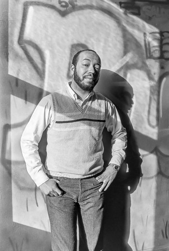 Movie still from “Beastie Boys Story” (2020), directed by Spike Jonze – Black and white photograph of a man with a beard; Medium shot, Low angle