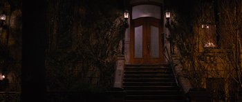 The front door of a house lit up at night