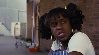 A young woman with a big black hair style