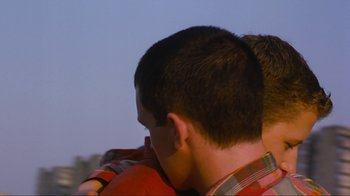 Movie still from “Beautiful Thing” (1996), directed by Hettie Macdonald – A young man's head and shoulders; Close Up shot, Over the shoulder angle