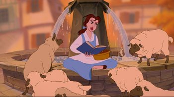 Movie still from “Beauty and the Beast” (1991), directed by Kirk Wise – A woman sitting on the ground reading a book while surrounded by sheep; Wide shot, Overhead angle