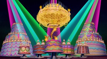 Movie still from “Beauty and the Beast” (1991), directed by Kirk Wise – A group of cakes that are on a table; Extreme Wide shot, High angle